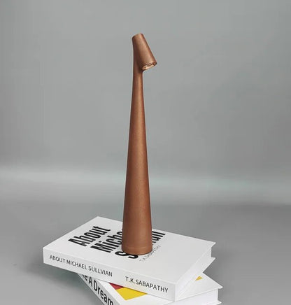 Cordless reading lamp with downward shade on a nightstand, ideal for apartment dwellers and students