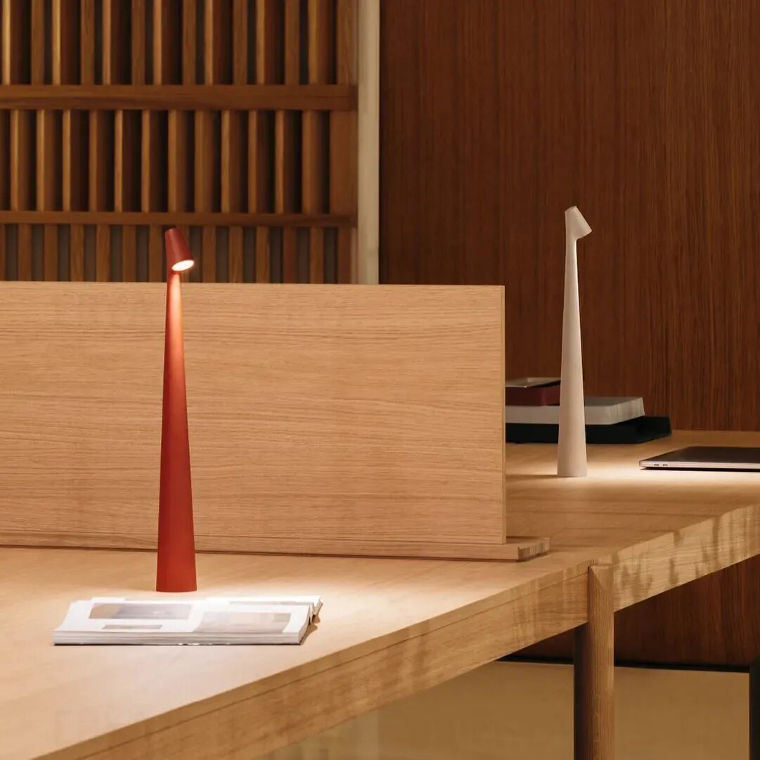 Cordless reading lamp with downward shade on a nightstand, ideal for apartment dwellers and students