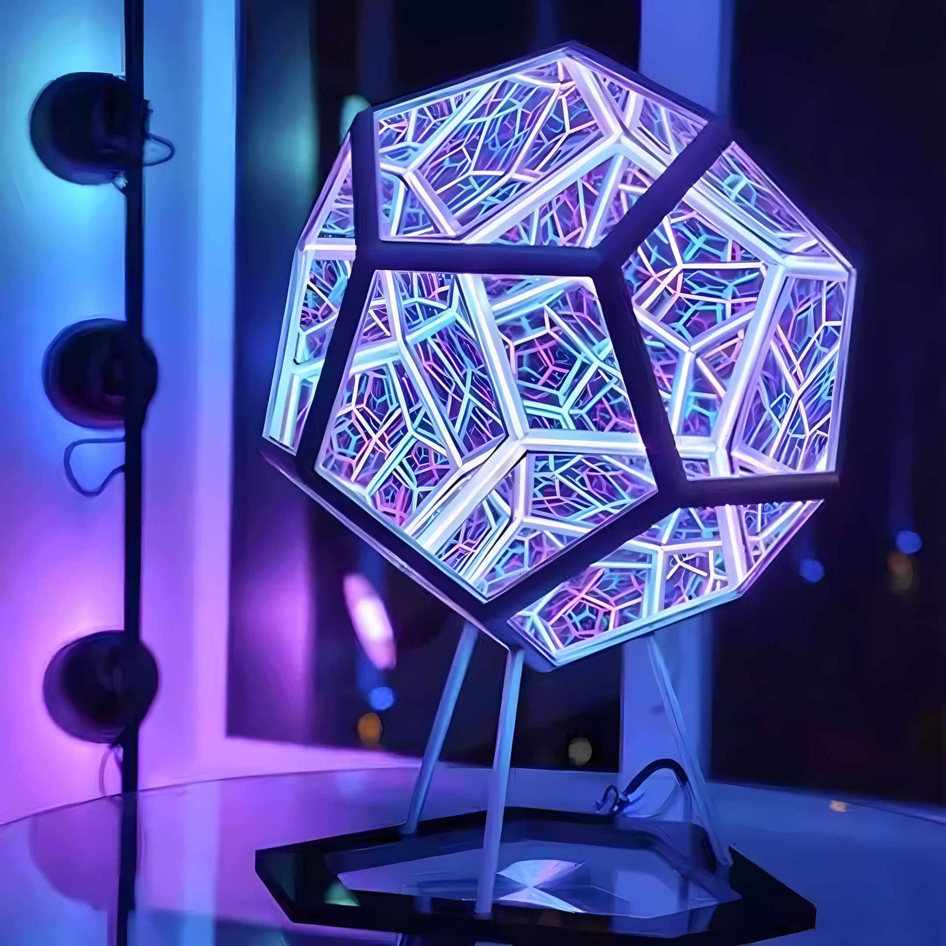 3D infinity mirror dodecahedron night light with rainbow LED glow on a wall, creating a photo backdrop for parties