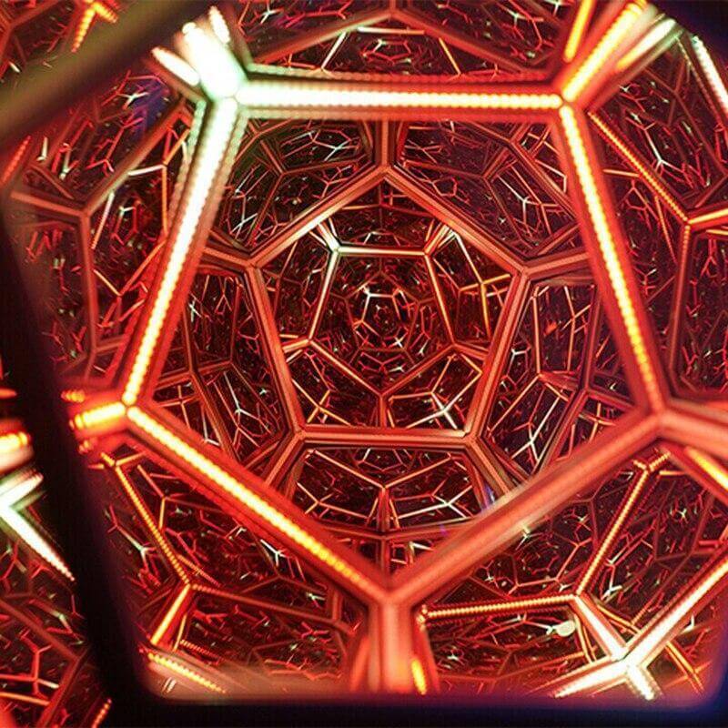 3D infinity mirror dodecahedron night light with rainbow LED glow on a wall, creating a photo backdrop for parties