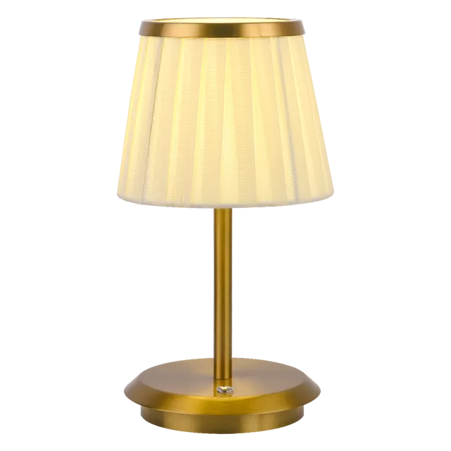 Cordless rechargeable table lamp with gold frame and fabric shade on a desk