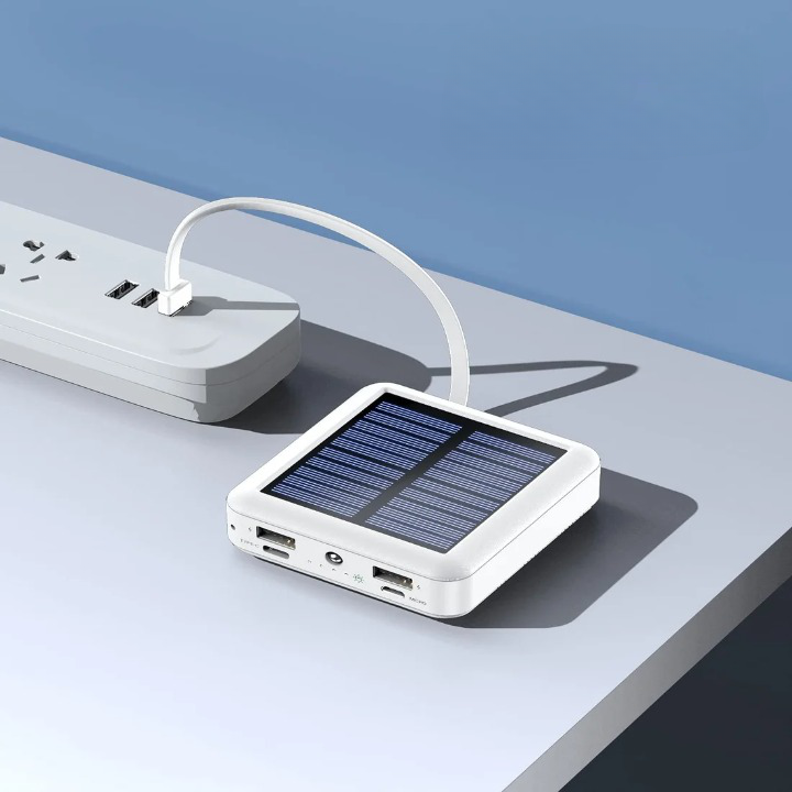 Compact solar power bank with LED flashlight and multiple cables for emergency preparedness