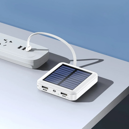 Compact solar power bank with LED flashlight and multiple cables for emergency preparedness