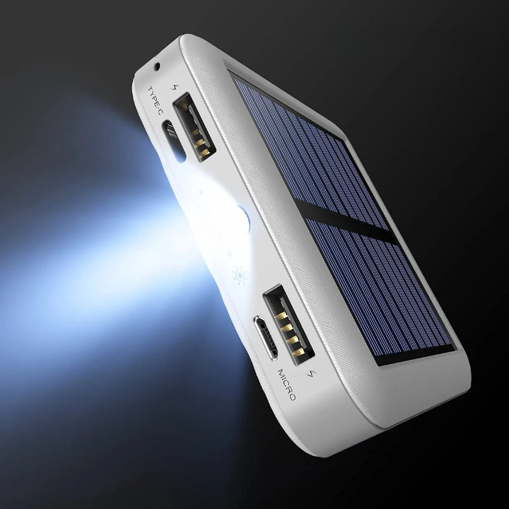 Compact solar power bank with LED flashlight and multiple cables for emergency preparedness