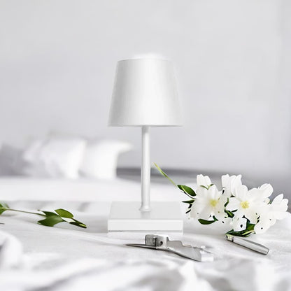 Cordless table lamp with aluminum body and touch controls, suitable for outdoor and bathroom use