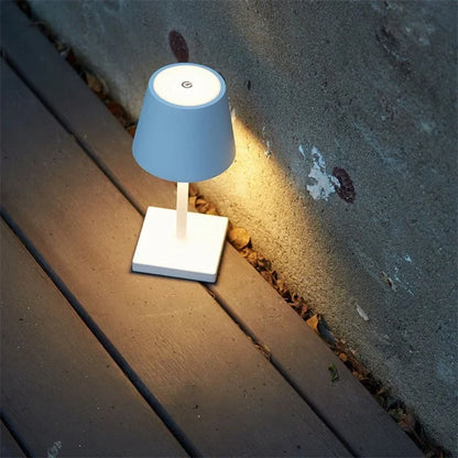 Cordless table lamp with aluminum body and touch controls, suitable for outdoor and bathroom use