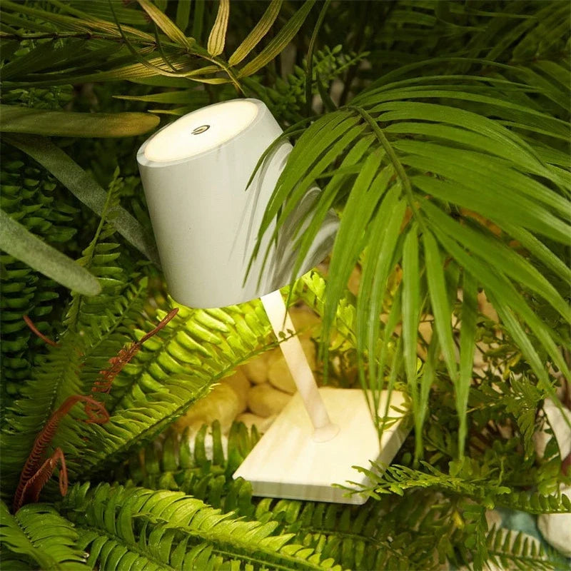 Cordless table lamp with aluminum body and touch controls, suitable for outdoor and bathroom use