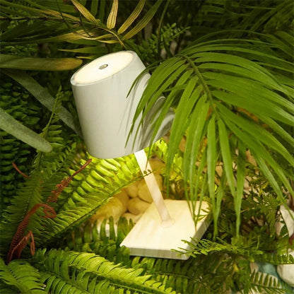 Cordless table lamp with aluminum body and touch controls, suitable for outdoor and bathroom use