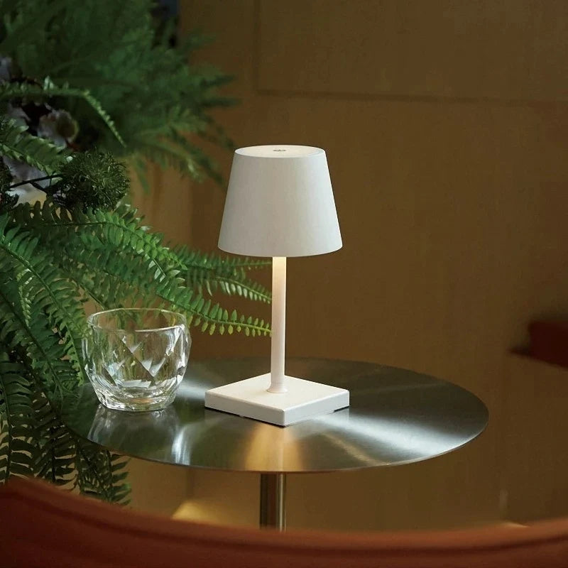 Cordless table lamp with aluminum body and touch controls, suitable for outdoor and bathroom use