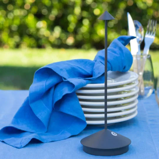 Cordless LED table lamp on a patio table for outdoor ambiance