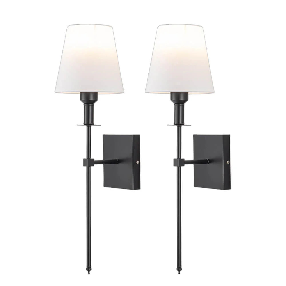 Rechargeable wireless wall sconce with metal and cloth shade, mounted on a wall in a living room, no cords visible