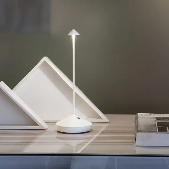 Cordless LED table lamp on a patio table for outdoor ambiance