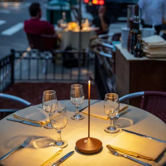 Cordless LED table lamp on a patio table for outdoor ambiance