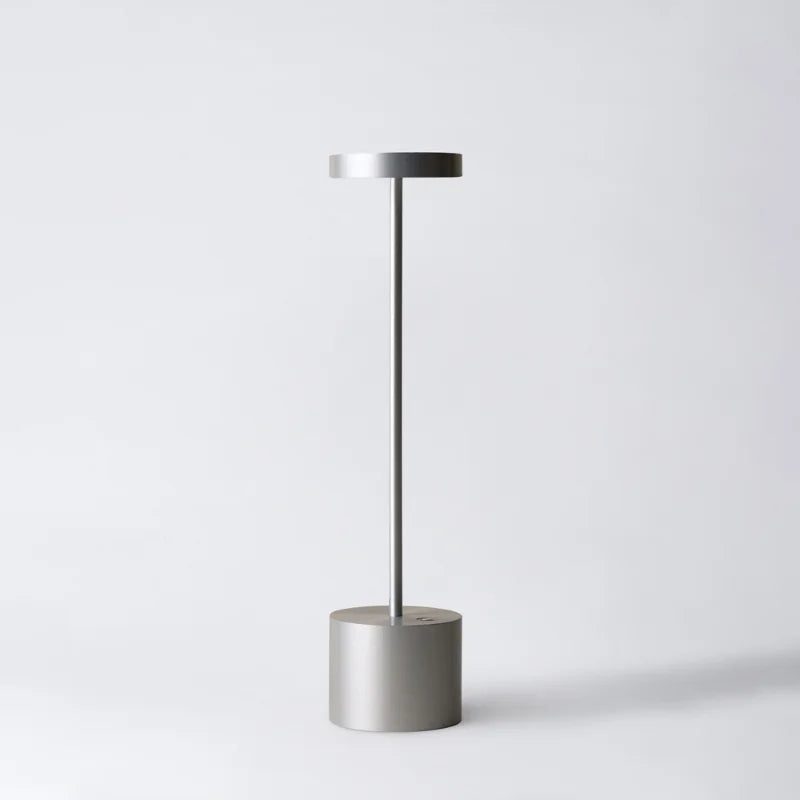 Cordless table lamp with warm light on an outdoor dining table