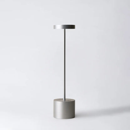 Cordless table lamp with warm light on an outdoor dining table
