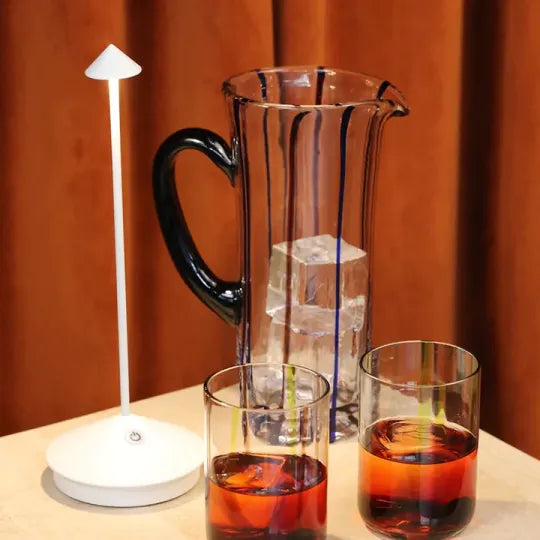 Cordless LED table lamp on a patio table for outdoor ambiance