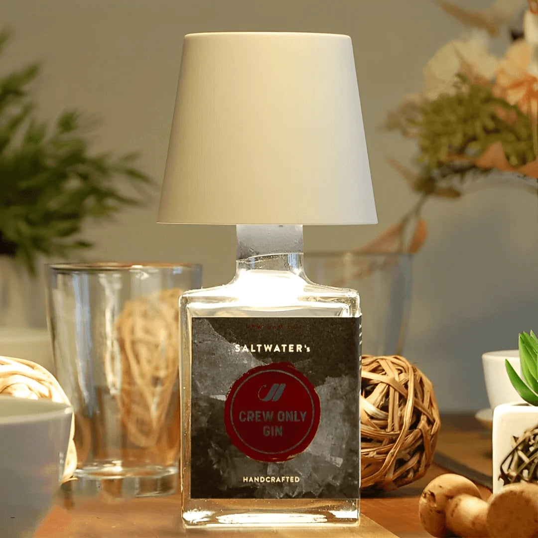 Rechargeable wine bottle light with color-changing LED on a black bottle for home entertaining