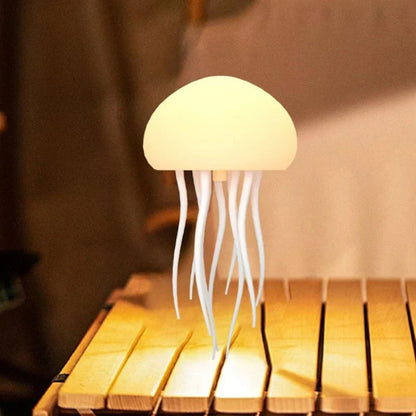 Cordless rechargeable table lamp with warm ambient glow on a shelf in an apartment
