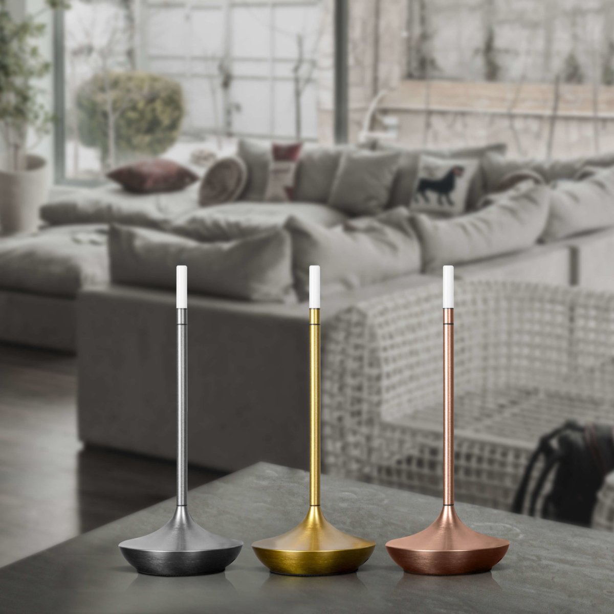 Rechargeable portable LED candle lamp with warm amber glow on a table, suitable for indoor and outdoor ambiance