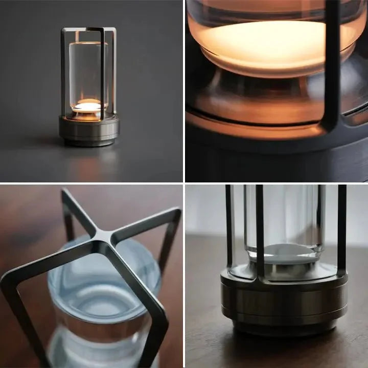 Cordless table lamp with metal cage and warm glow on a camping table