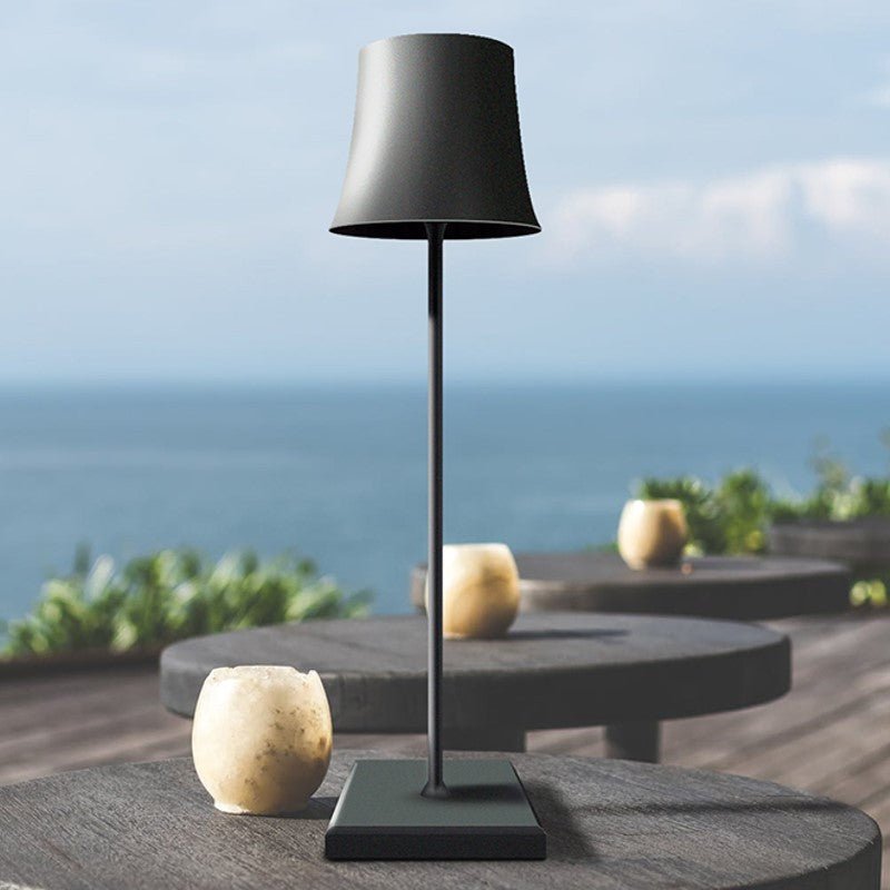 Cordless touch table lamp on a bedside table with soft warm light