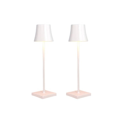 Cordless touch table lamp on a bedside table with soft warm light