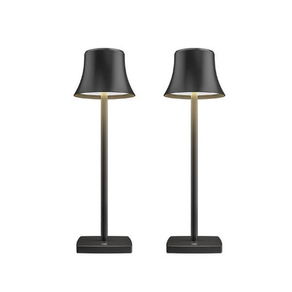 Cordless touch table lamp on a bedside table with soft warm light