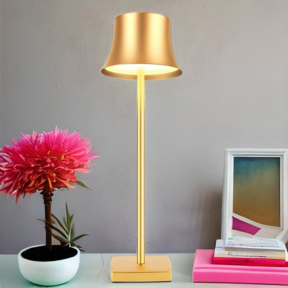 Cordless touch table lamp on a bedside table with soft warm light