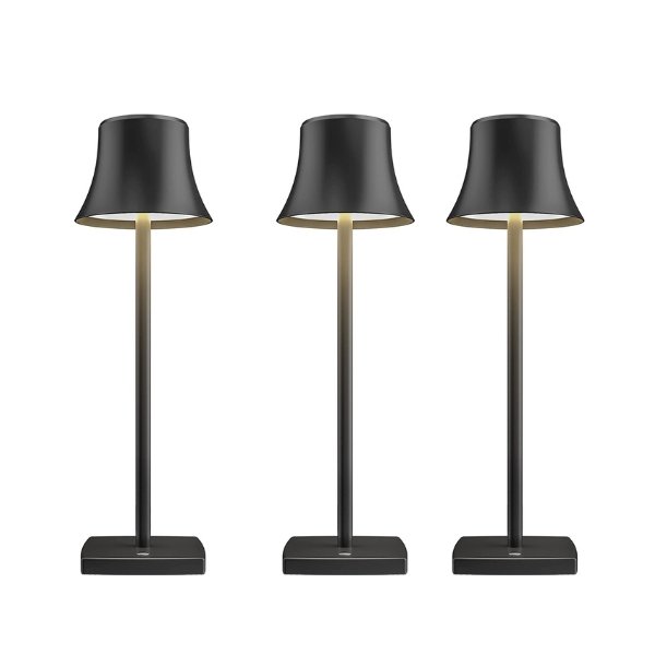 Cordless touch table lamp on a bedside table with soft warm light