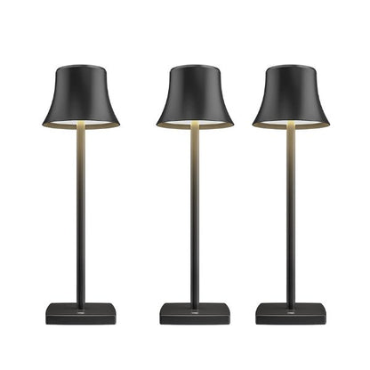 Cordless touch table lamp on a bedside table with soft warm light