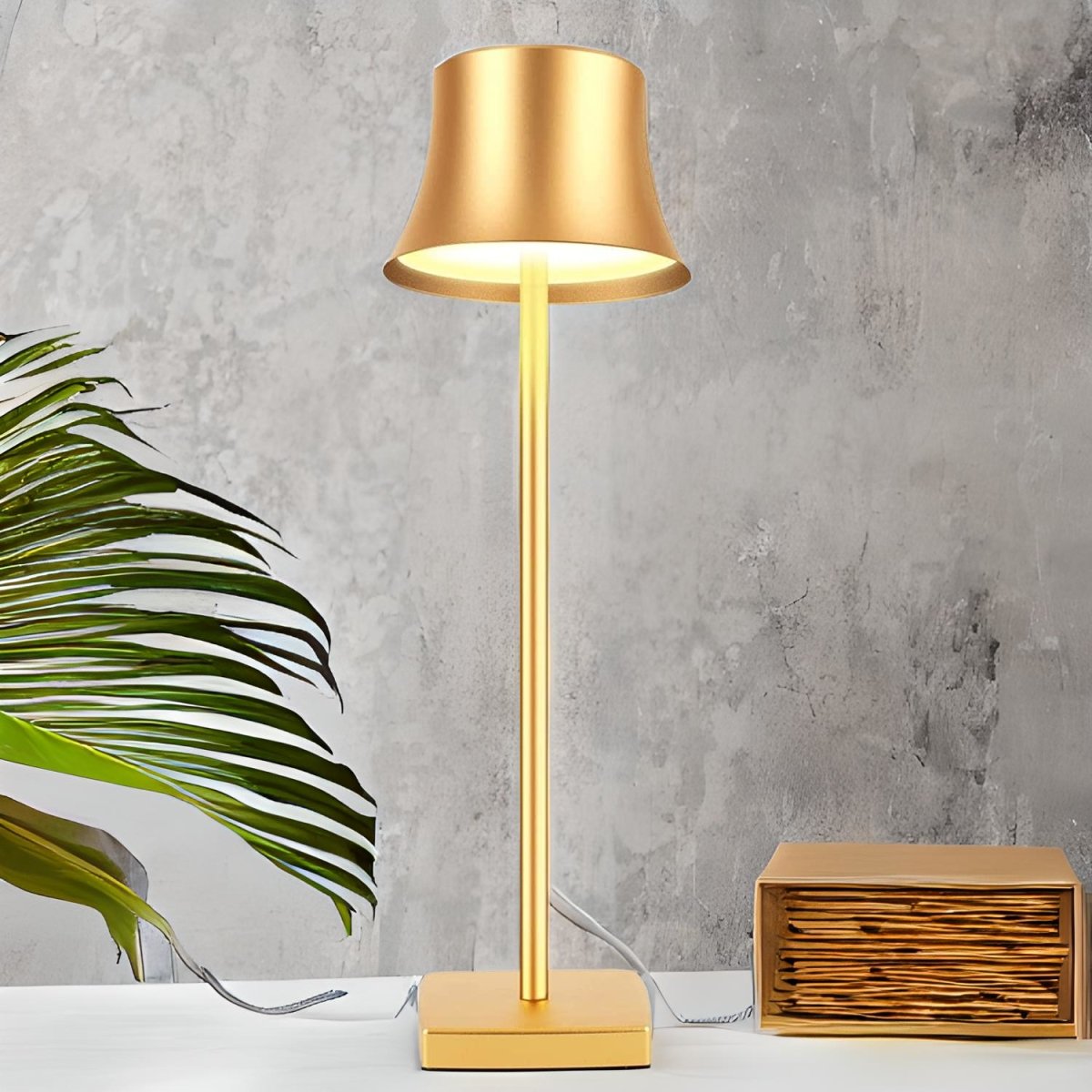 Cordless touch table lamp on a bedside table with soft warm light