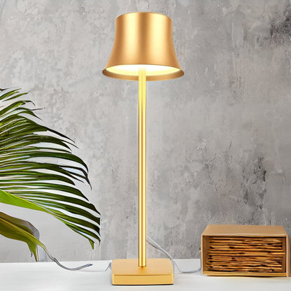 Cordless touch table lamp on a bedside table with soft warm light