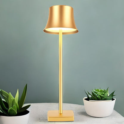 Cordless touch table lamp on a bedside table with soft warm light