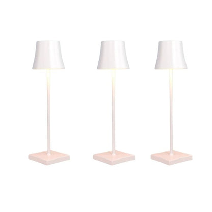 Cordless touch table lamp on a bedside table with soft warm light