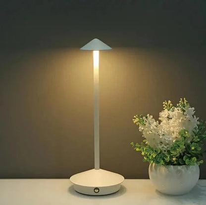 Cordless table lamp with warm ambient light on a patio, no cords