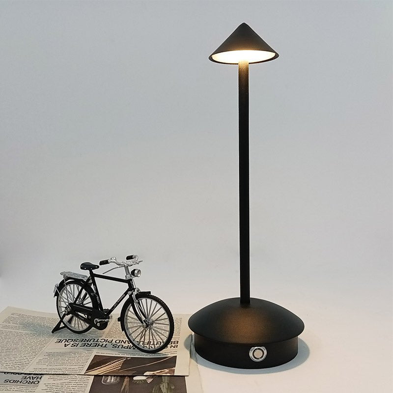Cordless table lamp with warm ambient light on a patio, no cords
