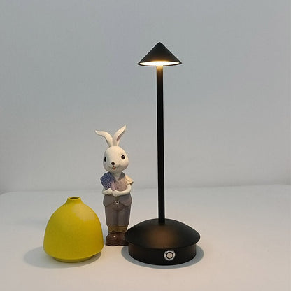 Cordless table lamp with warm ambient light on a patio, no cords