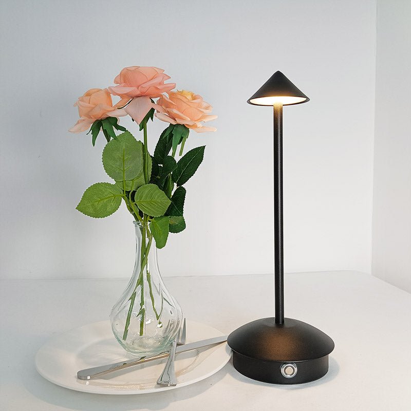 Cordless table lamp with warm ambient light on a patio, no cords