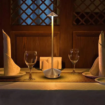 Cordless table lamp with warm ambient light on a patio, no cords
