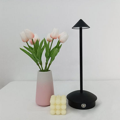 Cordless table lamp with warm ambient light on a patio, no cords