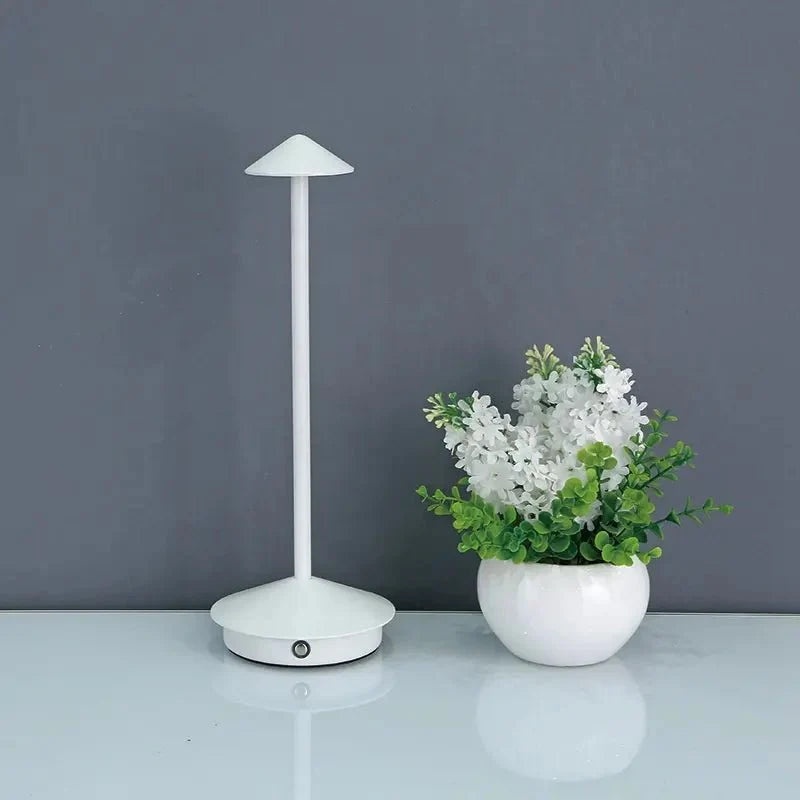 Cordless table lamp with warm ambient light on a patio, no cords