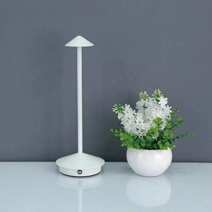 Cordless table lamp with warm ambient light on a patio, no cords