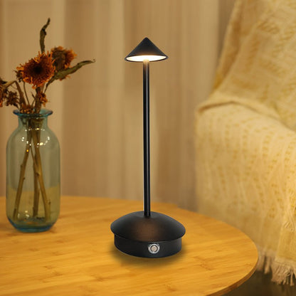 Cordless table lamp with warm ambient light on a patio, no cords
