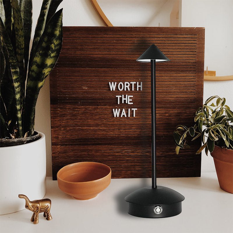 Cordless table lamp with warm ambient light on a patio, no cords