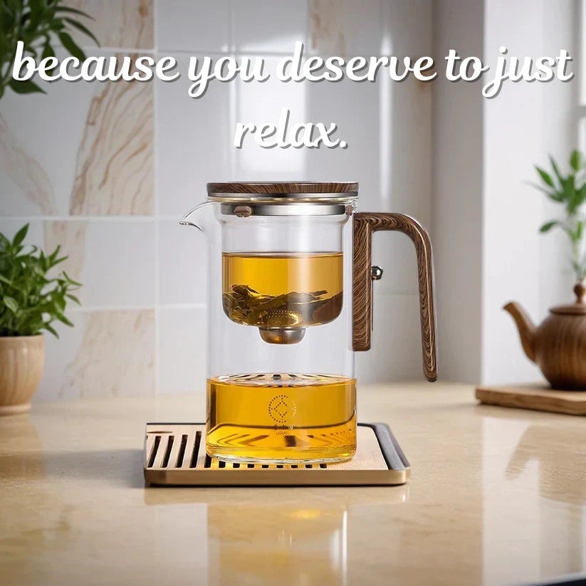 Glass teapot with one-press straining mechanism for loose-leaf tea