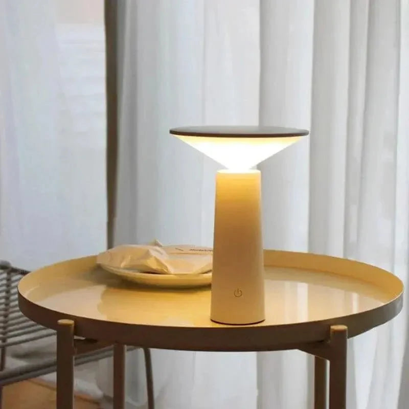 Cordless rechargeable LED table lamp with rotating head for camping and outdoor use