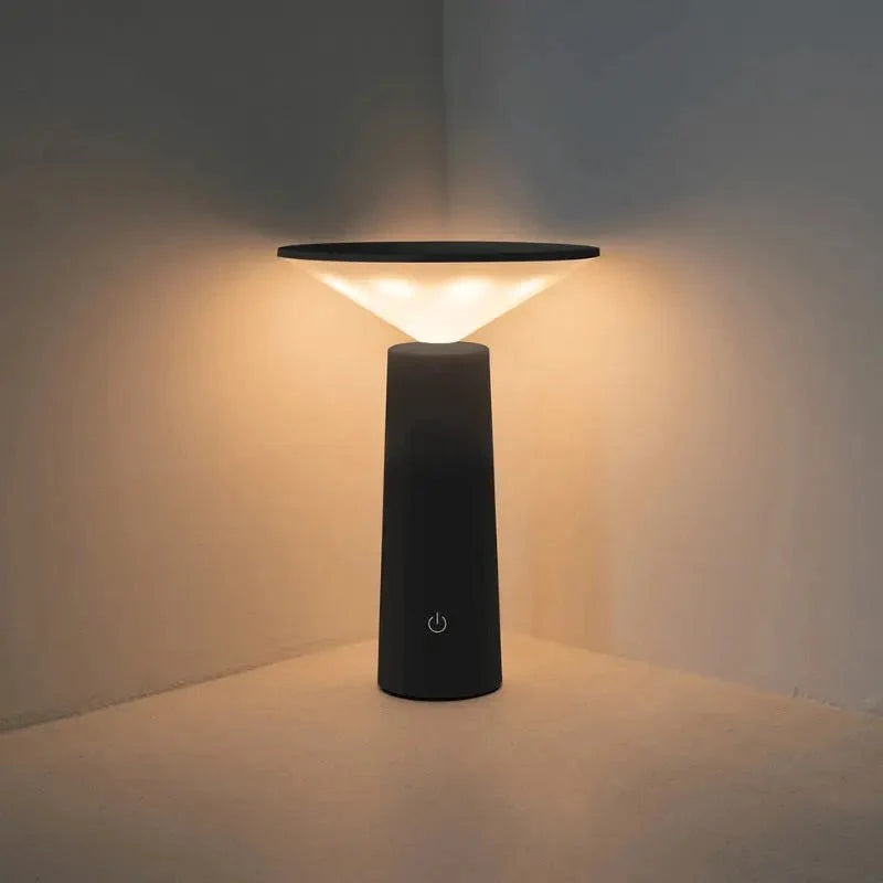 Cordless rechargeable LED table lamp with rotating head for camping and outdoor use