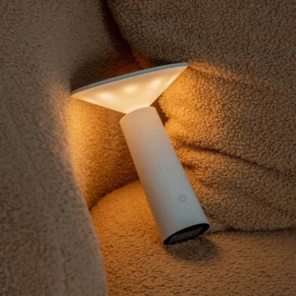 Cordless rechargeable LED table lamp with rotating head for camping and outdoor use