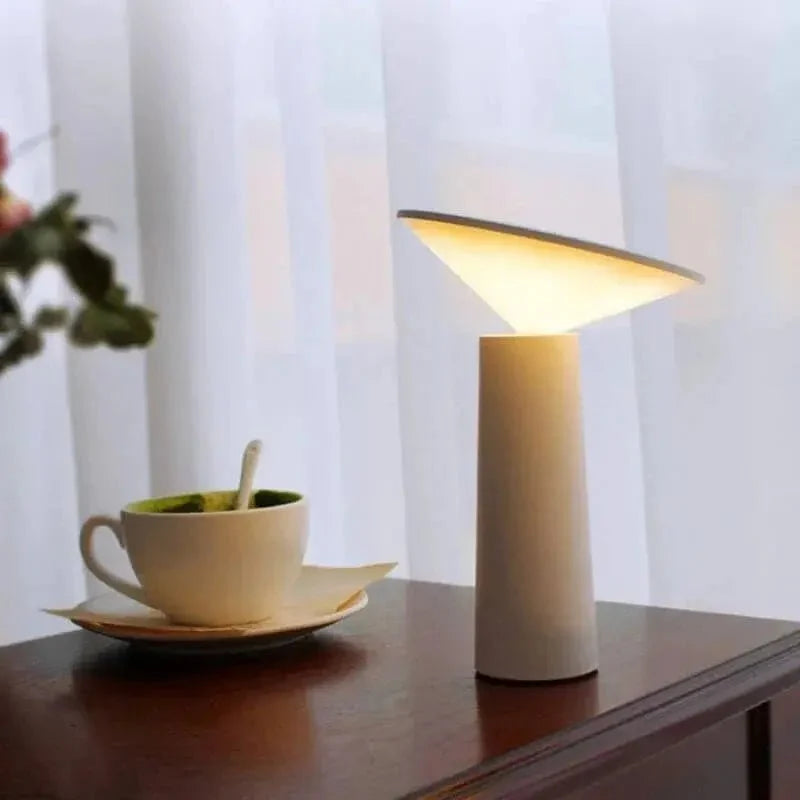 Cordless rechargeable LED table lamp with rotating head for camping and outdoor use