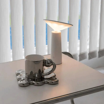 Cordless rechargeable LED table lamp with rotating head for camping and outdoor use